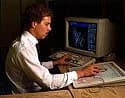 Engineer at an early-generation measurement workstation